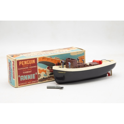 3164 - Penguin Series Clockwork Powered Tugboat 'Annie', funnel present, original Penguin key present, all ... 