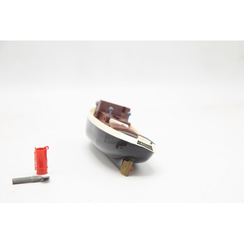 3164 - Penguin Series Clockwork Powered Tugboat 'Annie', funnel present, original Penguin key present, all ... 