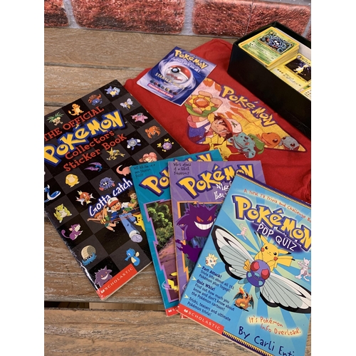 3351 - Assortment of vintage Pokemon collectables to include cards, book and a child's Pokemon T-shirt