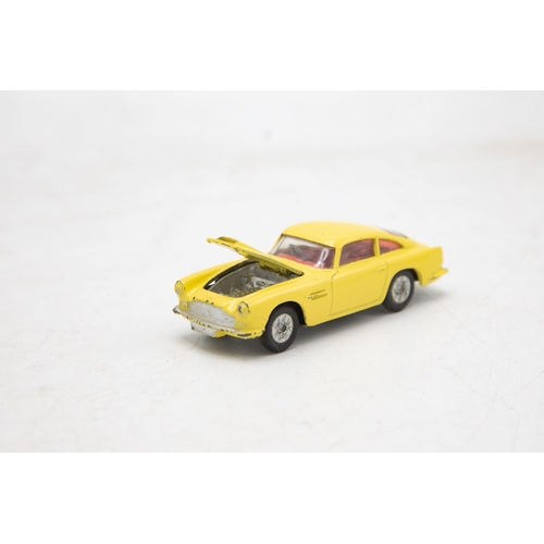 3283 - Corgi Toys 218 Aston Martin D.B.4, yellow, cast spoked wheels, very near mint, and boxed