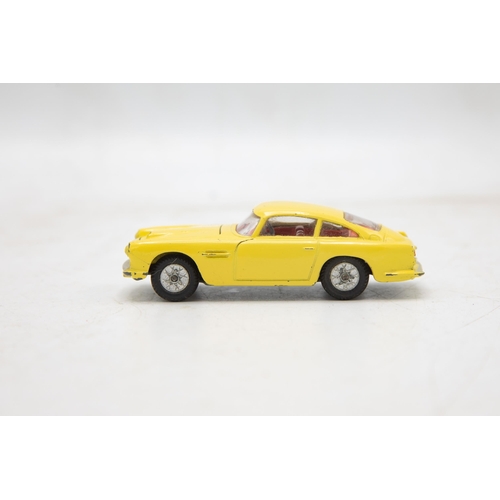 3283 - Corgi Toys 218 Aston Martin D.B.4, yellow, cast spoked wheels, very near mint, and boxed