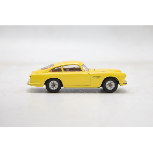 3283 - Corgi Toys 218 Aston Martin D.B.4, yellow, cast spoked wheels, very near mint, and boxed