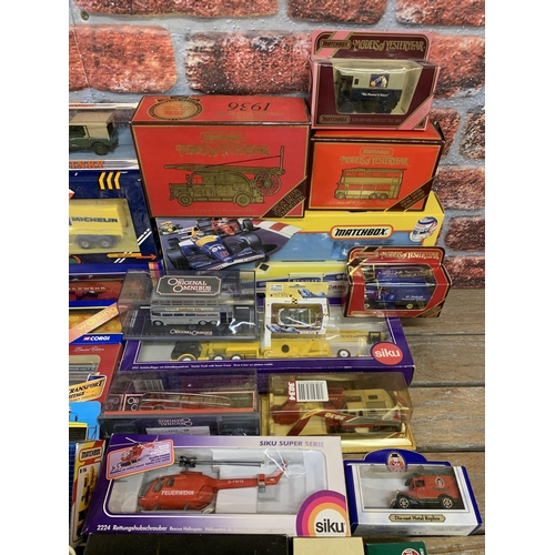 3439 - Large collection of boxed die cast vehicles to include Matchbox, Corgi and Siku examples