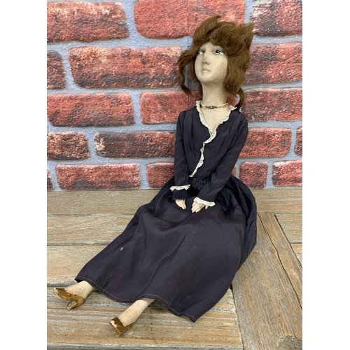 3471 - Unusual early 20th century felt face boudoir doll with enamel painted eyes, wooden arms and legs, in... 