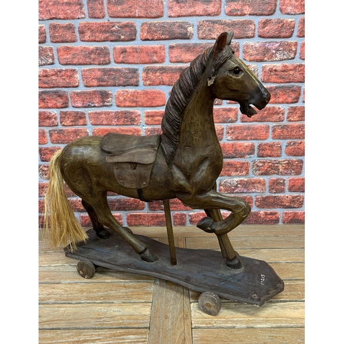 3472 - Vintage pull along carved wooden horse, glass eyes with leather saddle and horse hair tail, L82cm H7... 