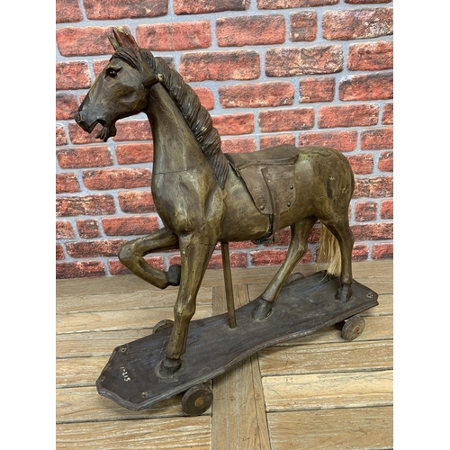 3472 - Vintage pull along carved wooden horse, glass eyes with leather saddle and horse hair tail, L82cm H7... 