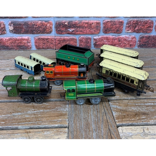 3536 - Quantity of tin plate mixed gauge trains to include clockwork examples and pre war Pullman carriages... 