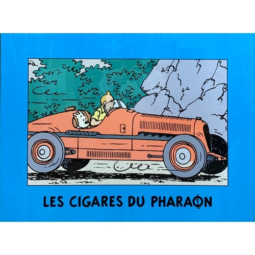 3690 - French Tin Tin 'Les Cigares Du Pharon' poster, depicting a racing Tin Tin with Snowy, both in a clas... 