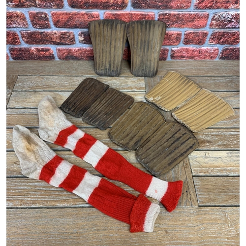 3744 - Football - collection of early 20th century brown leather shin pads with a period pair of red and wh... 