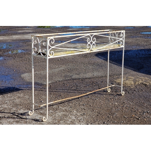 1309 - A painted wrought iron plant stand with scroll work detail, H 71cm x W 106cm x D 21cm