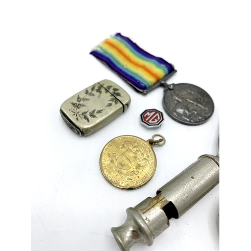 257 - Assortment of collectables to include WWI medals, police whistle and vesta etc