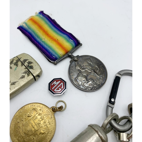 257 - Assortment of collectables to include WWI medals, police whistle and vesta etc