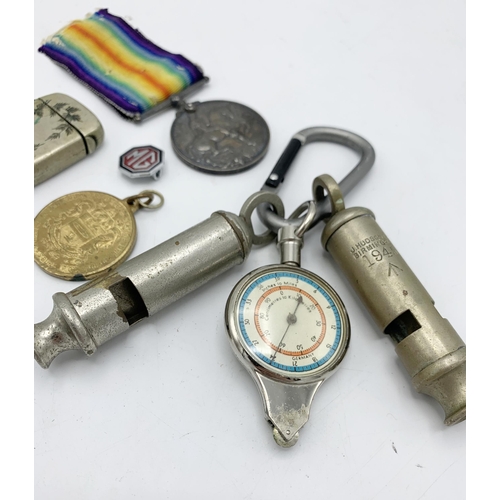 257 - Assortment of collectables to include WWI medals, police whistle and vesta etc