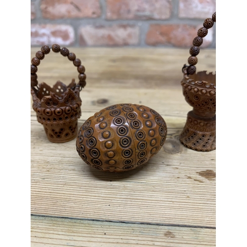 77 - Two Victorian hand carved treen coquilla nut baskets with similar cocquilla egg shaped sewing box (3... 