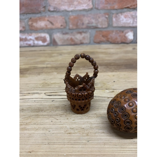 77 - Two Victorian hand carved treen coquilla nut baskets with similar cocquilla egg shaped sewing box (3... 