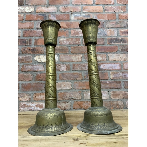 89 - Pair of large early 20th century Indian brass pricket candlesticks with scrolled engraved finish thr... 