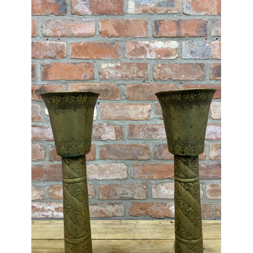 89 - Pair of large early 20th century Indian brass pricket candlesticks with scrolled engraved finish thr... 