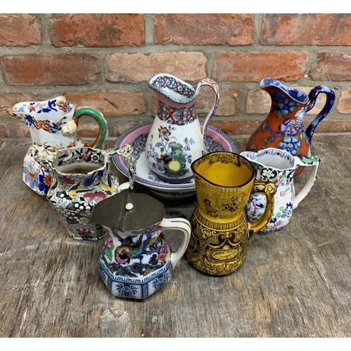 124 - Quantity of mixed decorative ceramic jugs to include Masons & Royal Doulton 