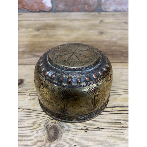 126 - Persian brass bowl with copper studded rim and lotus flower base, H 7cm x D 11cm