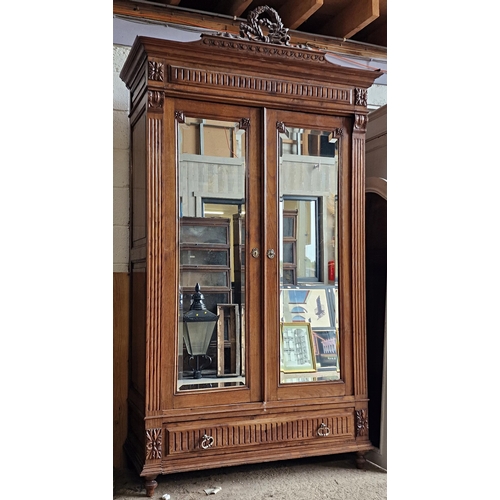 1010 - 19th century French carved walnut wardrobe with twin bevelled mirror panelled doors and single drawe... 