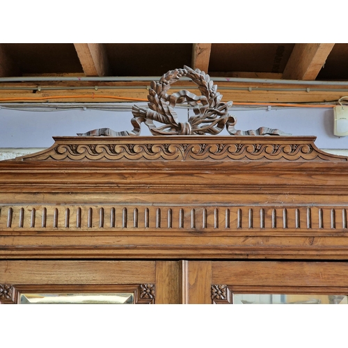 1010 - 19th century French carved walnut wardrobe with twin bevelled mirror panelled doors and single drawe... 