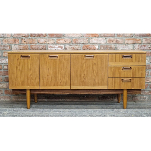 1011 - 20th century teak sideboard fitted with three drawers and cupboard doors, H 73cm x W 169cm x D 45cm