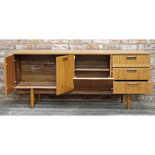 1011 - 20th century teak sideboard fitted with three drawers and cupboard doors, H 73cm x W 169cm x D 45cm