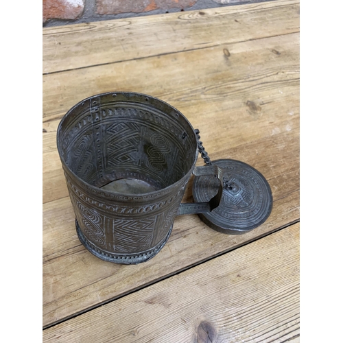 131 - Early Persian copper betel nut and lime holder, with faceted beaten panels, handle, lid and chain, 1... 