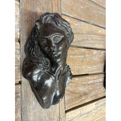 6 - Pair of cast resin wall plaques, candles holders in the shape of an attractive woman