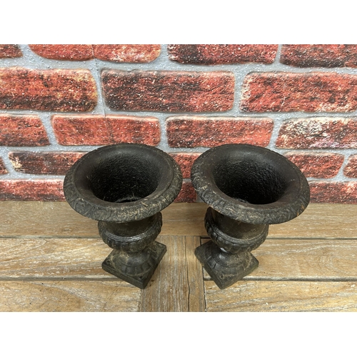 39 - Pair of miniature black cast iron garden urns, H 25cm (2)