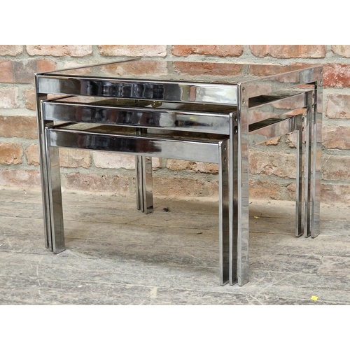 1025 - Good quality 20th century chrome and smoked glass nest of tables in the style of Merrow Associates, ... 