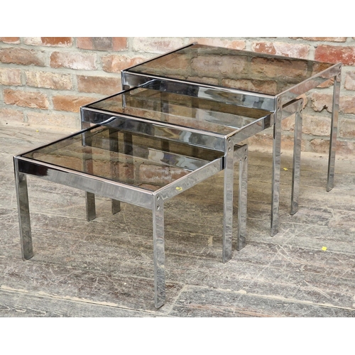 1025 - Good quality 20th century chrome and smoked glass nest of tables in the style of Merrow Associates, ... 