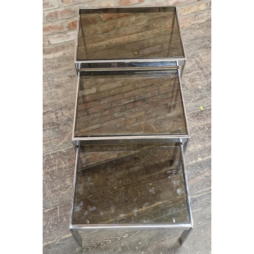 1025 - Good quality 20th century chrome and smoked glass nest of tables in the style of Merrow Associates, ... 