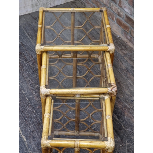 1067 - Contemporary bamboo nest of three tables with glass tops, H 55cm x W 50cm (largest)