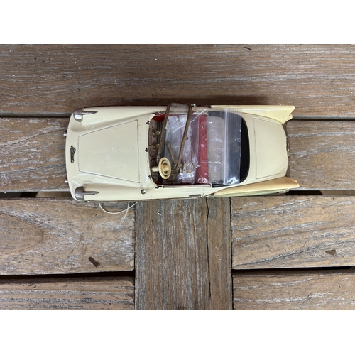 65 - Schuco Elektro-Radio tinplate model car with mint green/cream body, red interior and chrome trim, mo... 