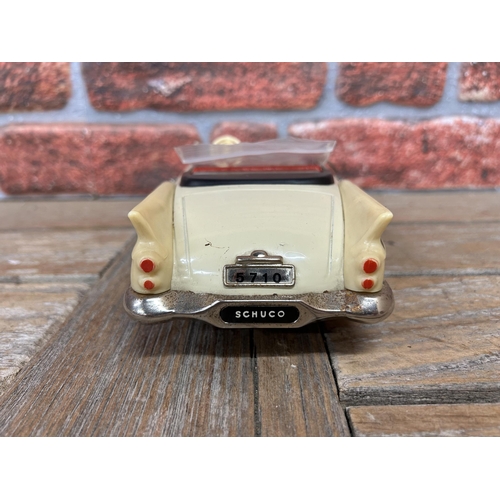 65 - Schuco Elektro-Radio tinplate model car with mint green/cream body, red interior and chrome trim, mo... 