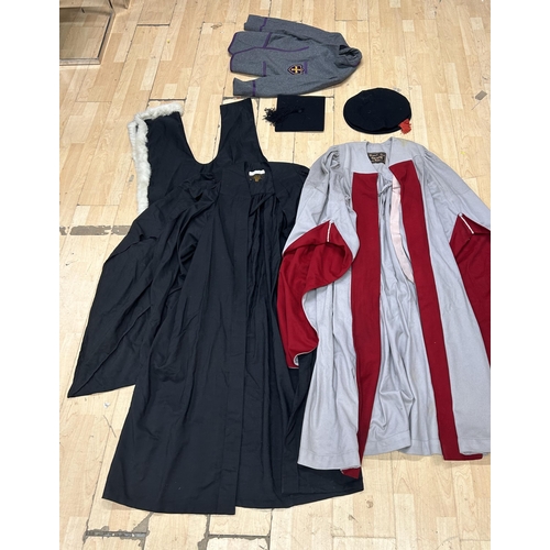 175 - Assortment of vintage University gowns and caps