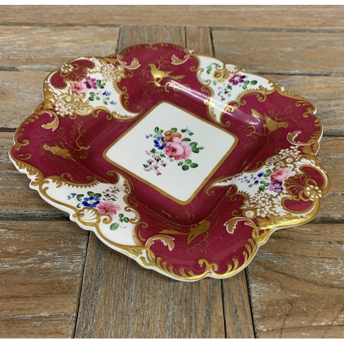 647 - Early 19th century H&R Daniel shell shaped ceramic dish having rich claret ground with a gilt bird a... 