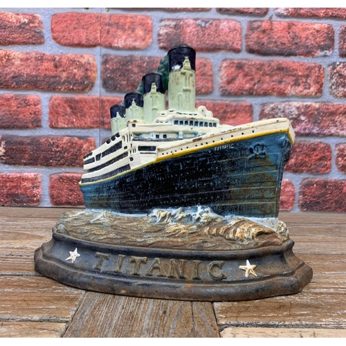 748 - Vintage cast iron Titanic door stop