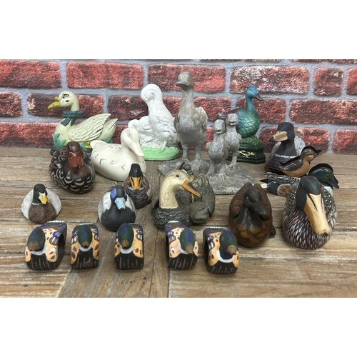 35 - Assortment of duck related collectables to include hand painted Folk Art decoys, cast iron doorstop ... 