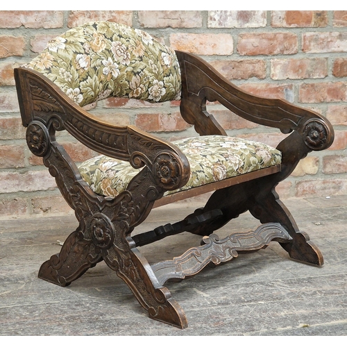 1076 - Antique X framed upholstered chair with carved detail