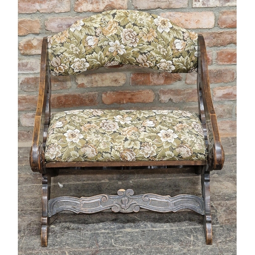 1076 - Antique X framed upholstered chair with carved detail