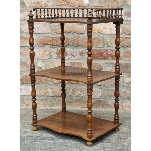 1077 - Victorian mahogany three tier serpentine whatnot with raised gallery back and turned supports, H 72c... 