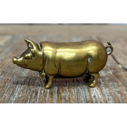 147 - Miniature brass pig vesta case and match strike, L 5cm (displayed in cabinet)