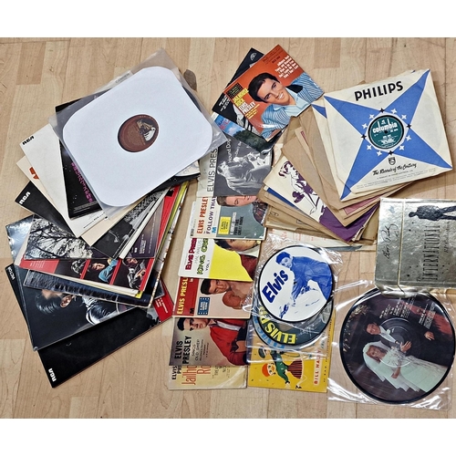 670 - Assortment of Elvis Presley related items to include vinyl singles, albums and 78's, together with C... 