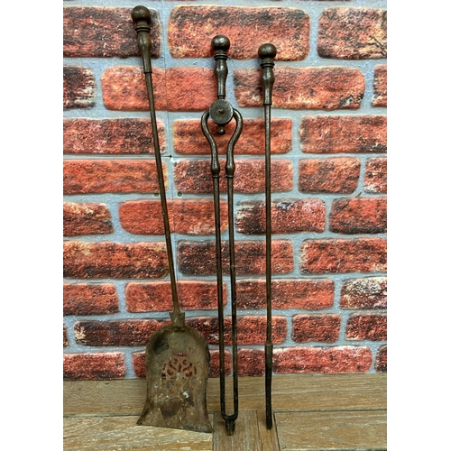 731 - Victorian wrought iron companion set to include poker. tongs and coal shovel (3)