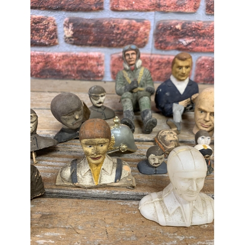 741 - Quantity of vintage model airplane pilots to include early rubber example and carved wood heads etc