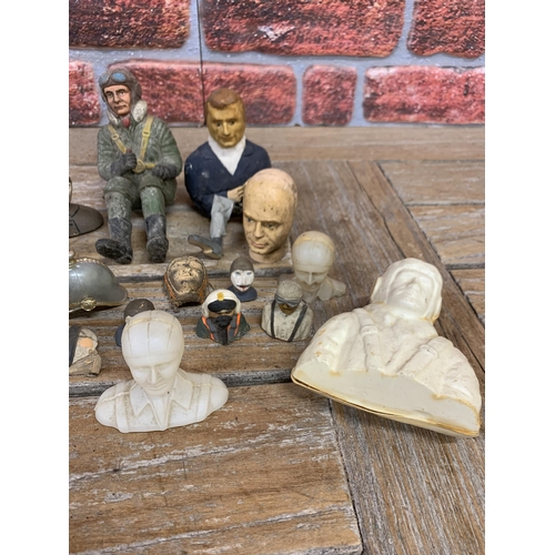 741 - Quantity of vintage model airplane pilots to include early rubber example and carved wood heads etc