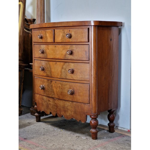 1045 - Victorian mahogany bow front chest of two short over three long drawers with shaped apron and turned... 