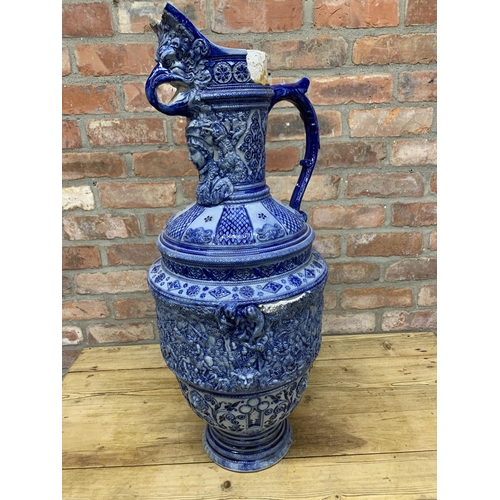 453 - Very large Westerwald Rhineware exhibition blue and white ewer with ornate battlefield scene,  H 86c... 